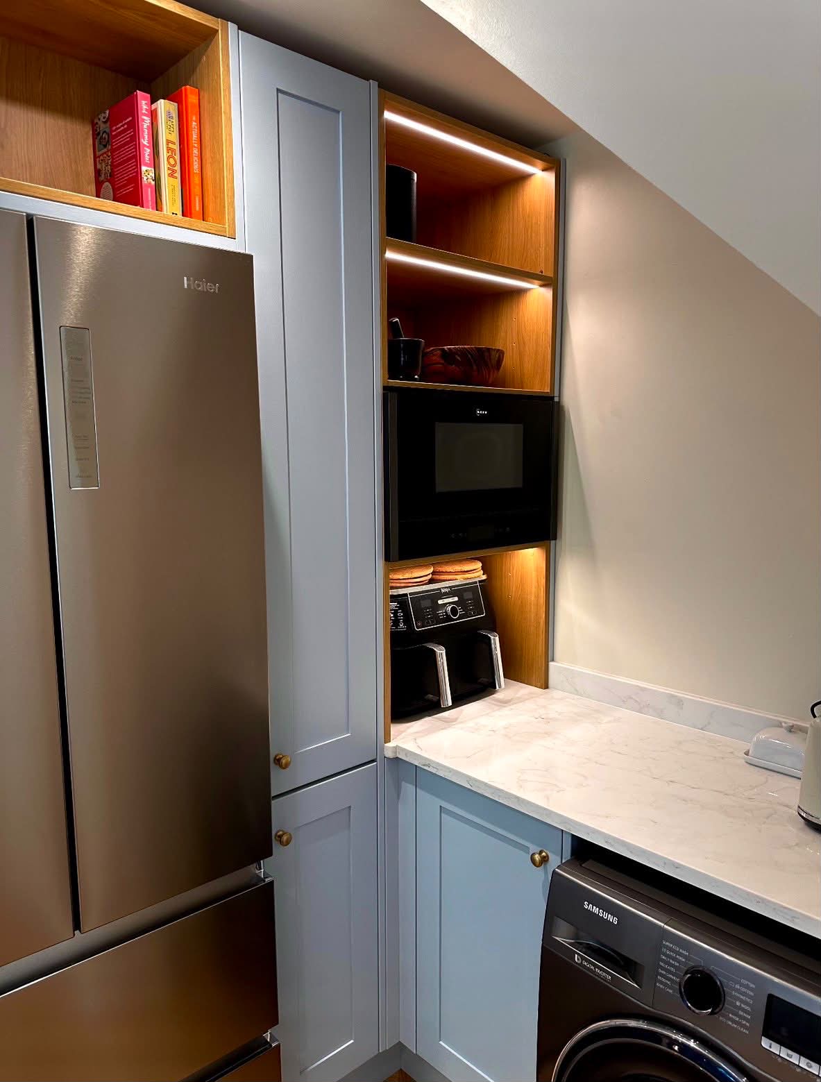 Residential kitchen LED strip lighting for built-in shelving and appliance cabinet
